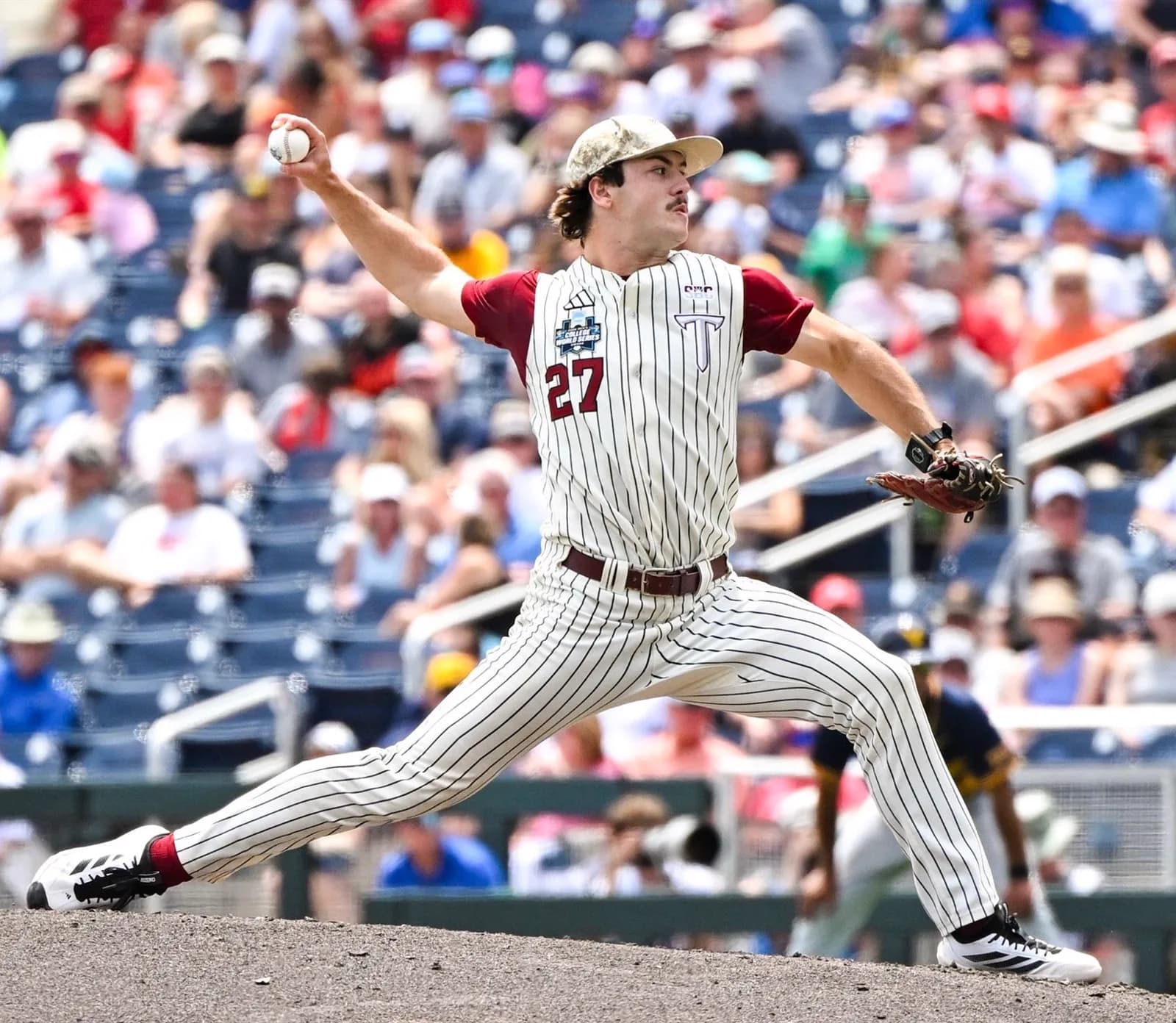 Dylan Alonso at full leg kick during his pitching delivery